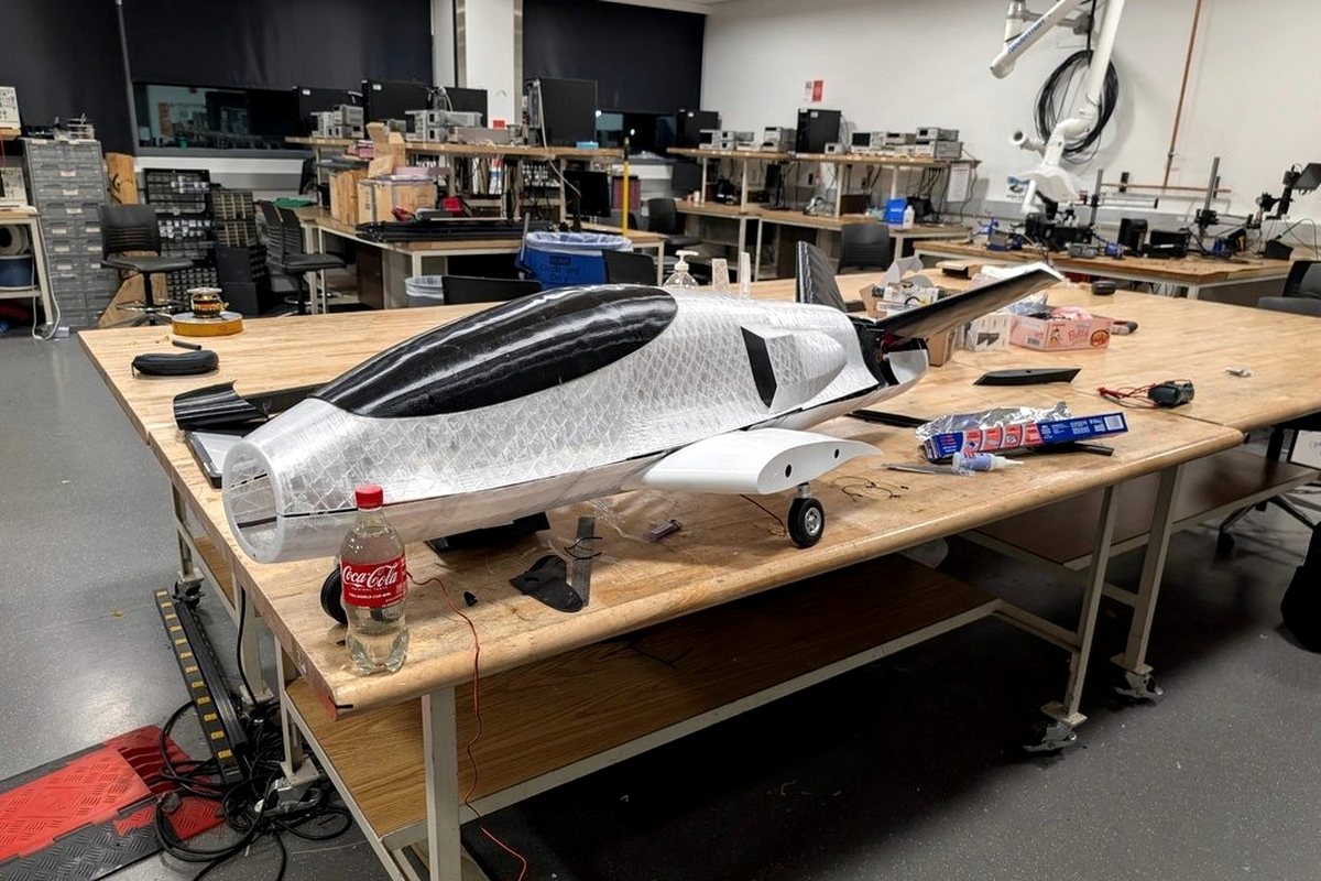 The full-scale Vritra airframe under construction on a workbench in an engineering lab.